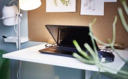 A close-up of a standing work station in a home office