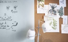 A close-up of a wall with whiteboard paint and corkboard