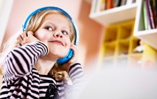 A girl listening to music in her headphones.