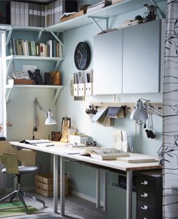 A wall of a home office with lots of storage