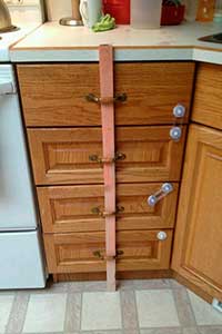Baby proofing drawers with a plank