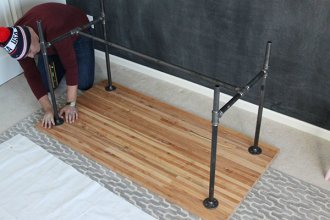 Straightening the pipe legs of a DIY work table