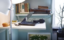 A close-up of a standing work station in a home office