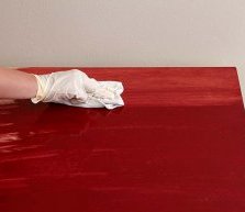 Wiping Away Excess Desk Stain